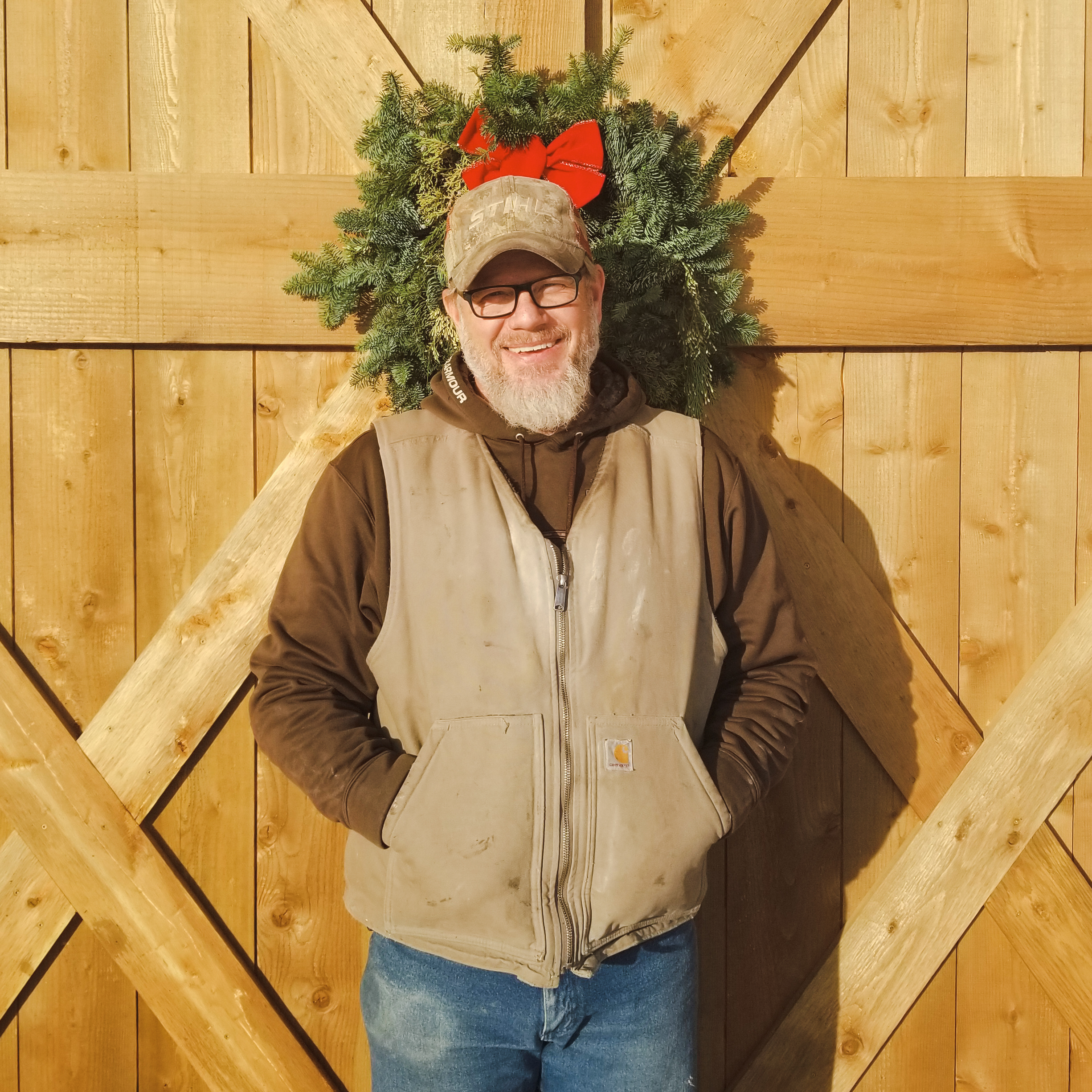 Steve feeling festive in front of Bluebird's Christmas Decor